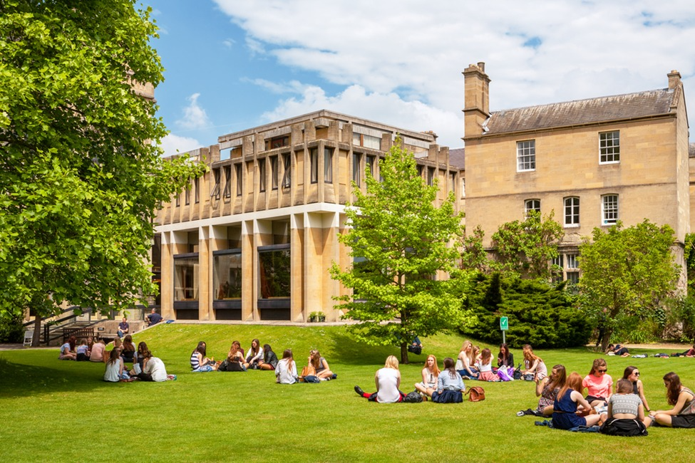 Students on a university lawn during a summer programme