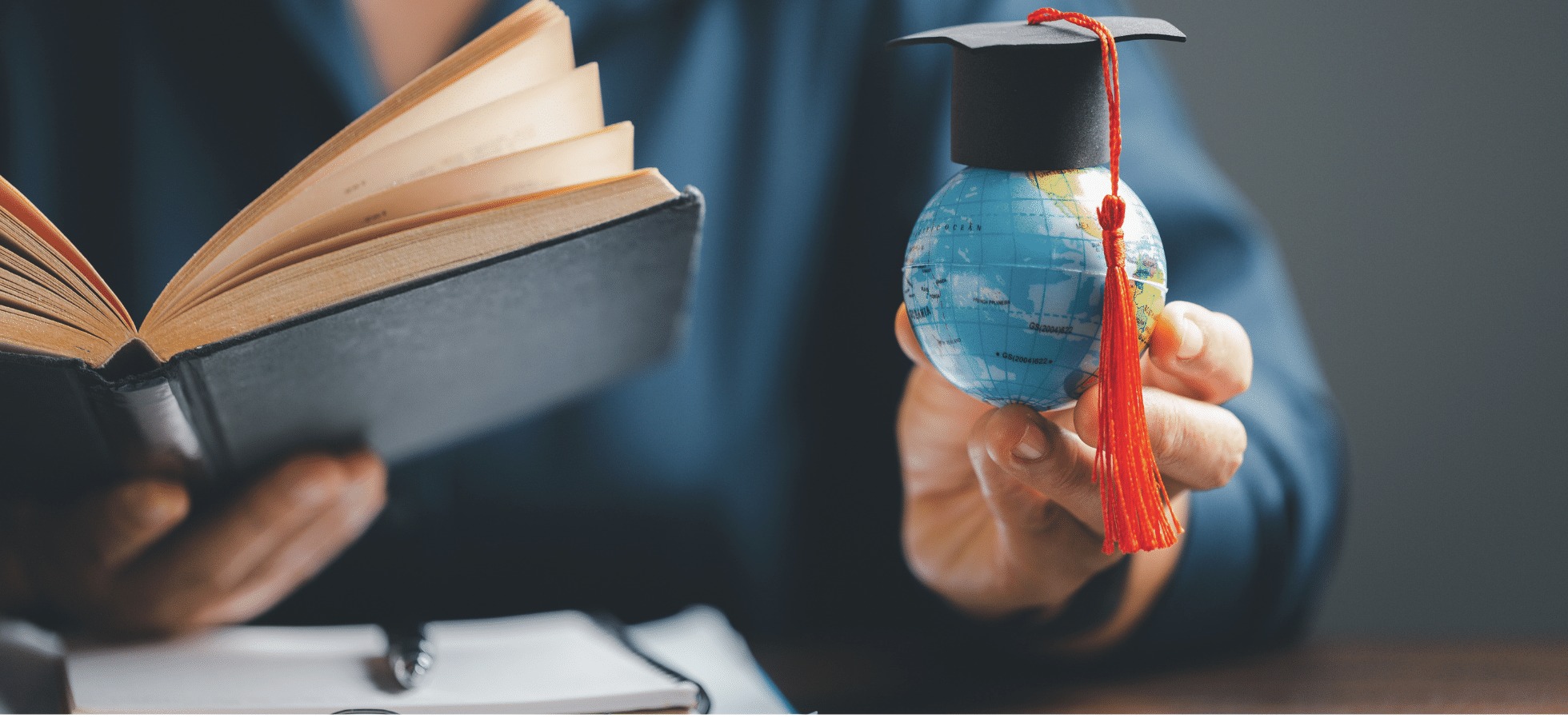 Student holding a globe with graduation cap and open book — Grades 9-12 strategy